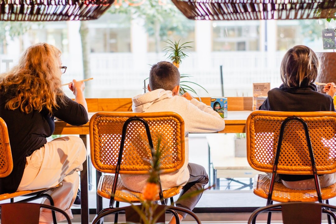 Group of Belgian entrepreneurs discussing a business idea around a table